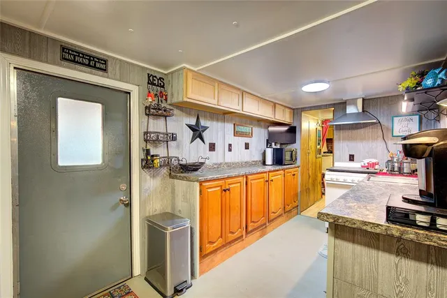 a kitchen with stainless steel appliances granite countertop a stove and a sink