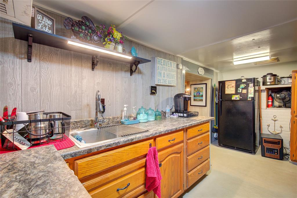 8 Lots Prairie Yantis, TX 75497 - Photo 13 of 26 a living room with stainless steel appliances kitchen island granite countertop a sink and cabinets