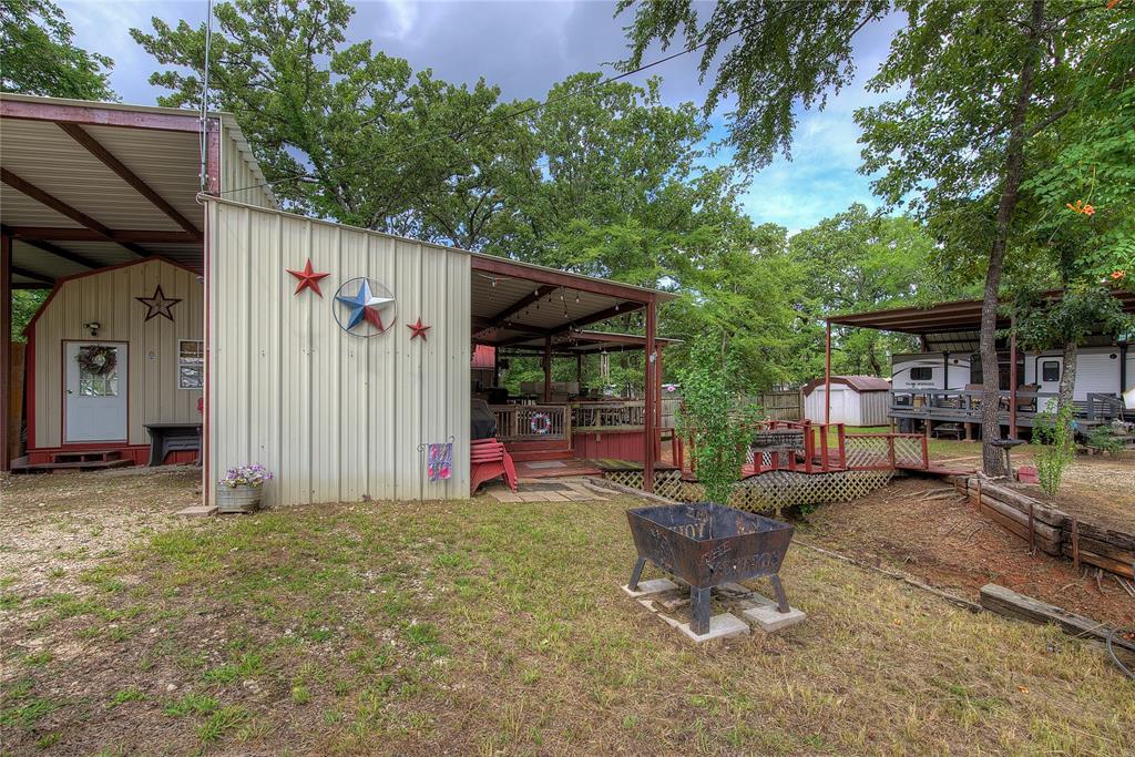 8 Lots Prairie Yantis, TX 75497 - Photo 5 of 26 a view of a patio with table and chairs and a large tree