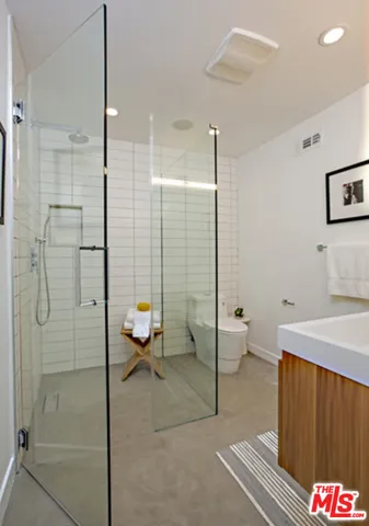 a bathroom with a shower and a toilet