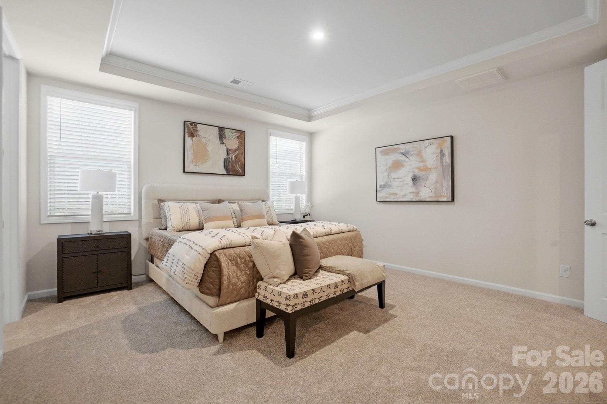 9931 Cask Way Huntersville, NC 28078 - Photo 20 of 42 a spacious bedroom with a bed and a couch