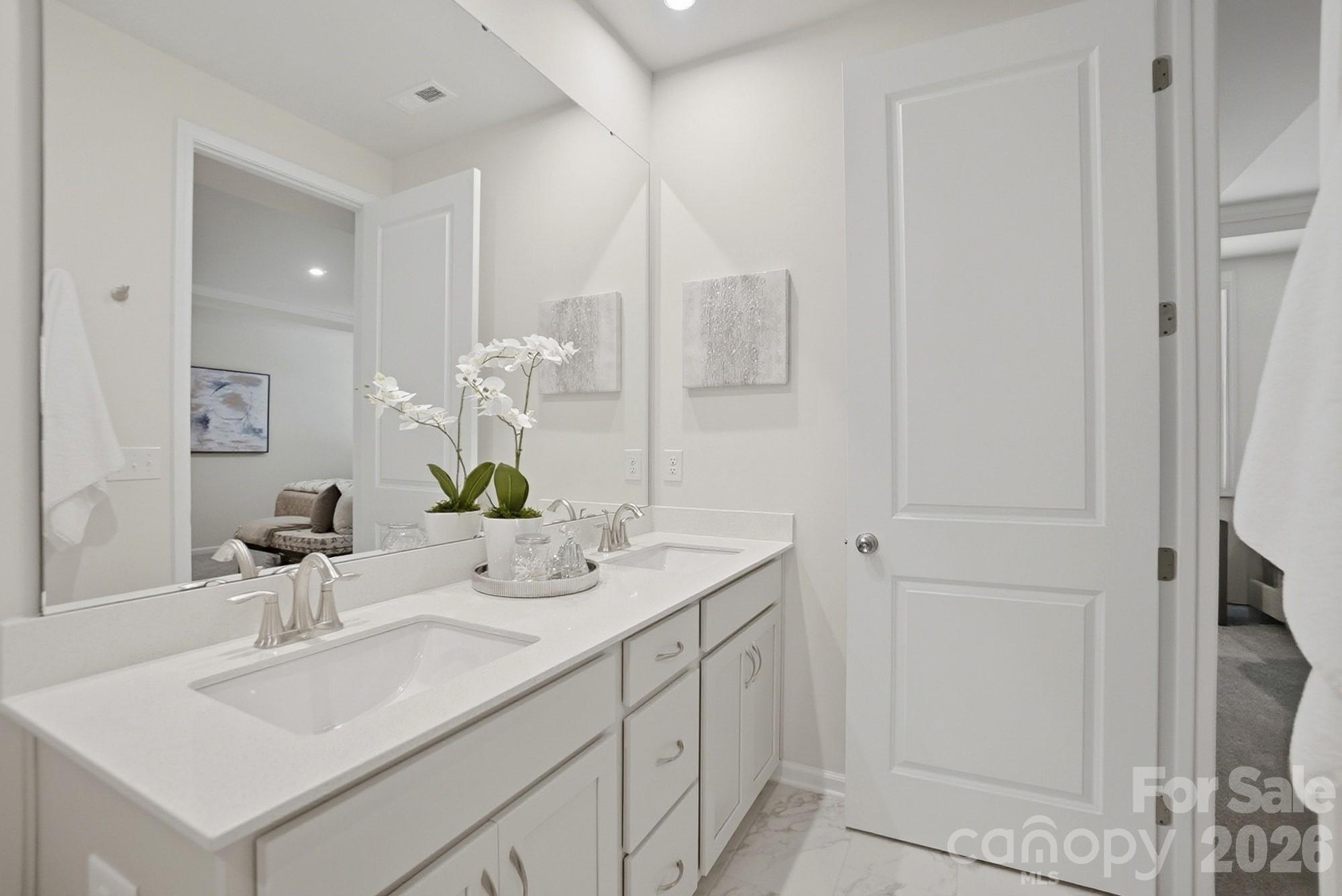 9931 Cask Way Huntersville, NC 28078 - Photo 23 of 42 a bathroom with a sink vanity granite and a mirror
