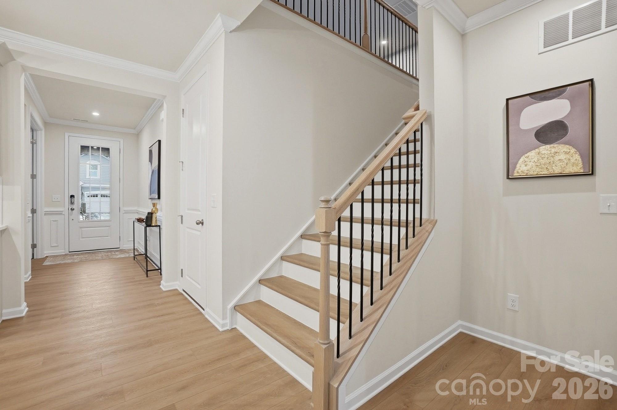 9931 Cask Way Huntersville, NC 28078 - Photo 25 of 42 a view of a hallway with wooden floor and staircase