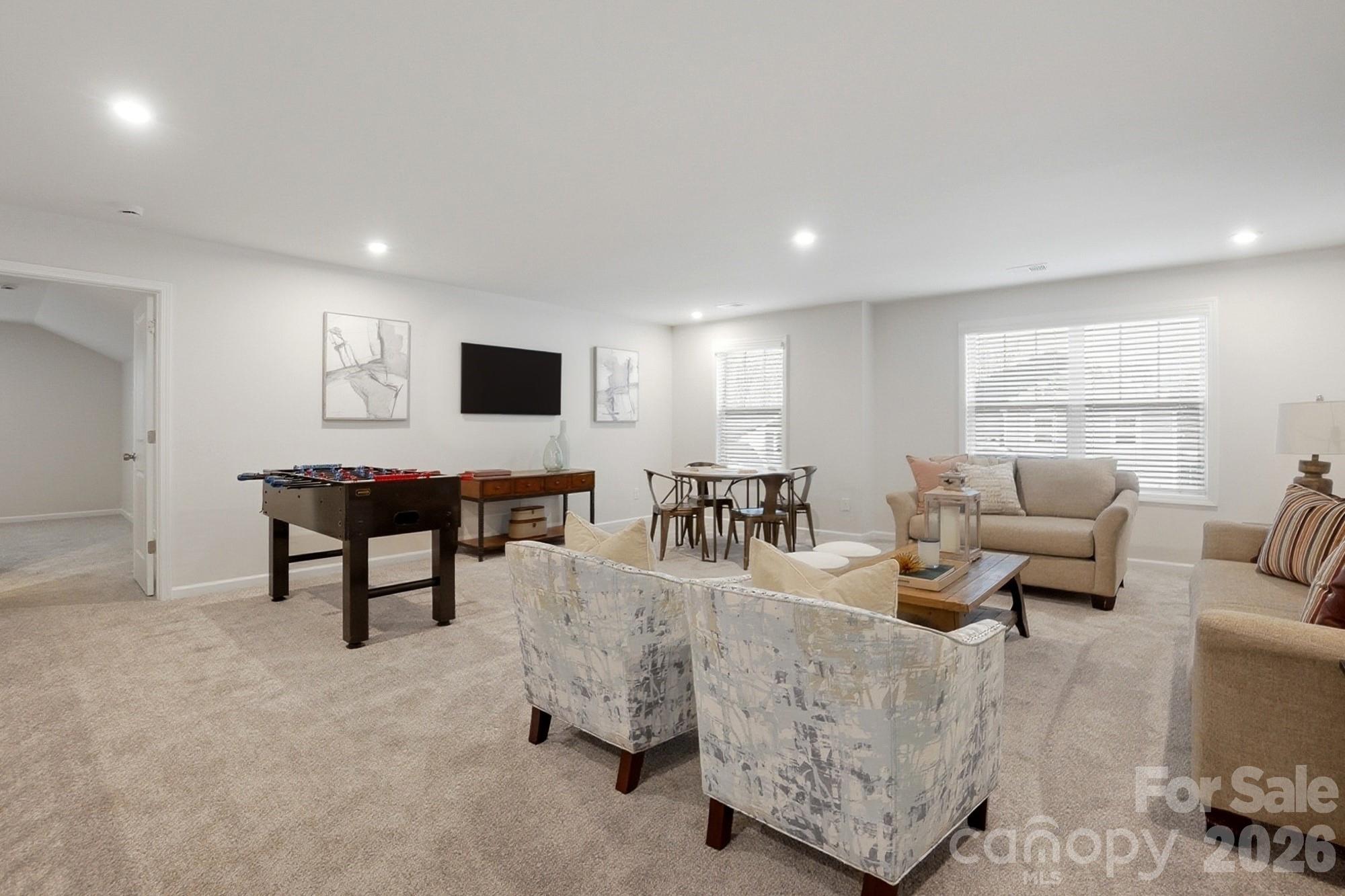 9931 Cask Way Huntersville, NC 28078 - Photo 27 of 42 a living room with furniture and a flat screen tv