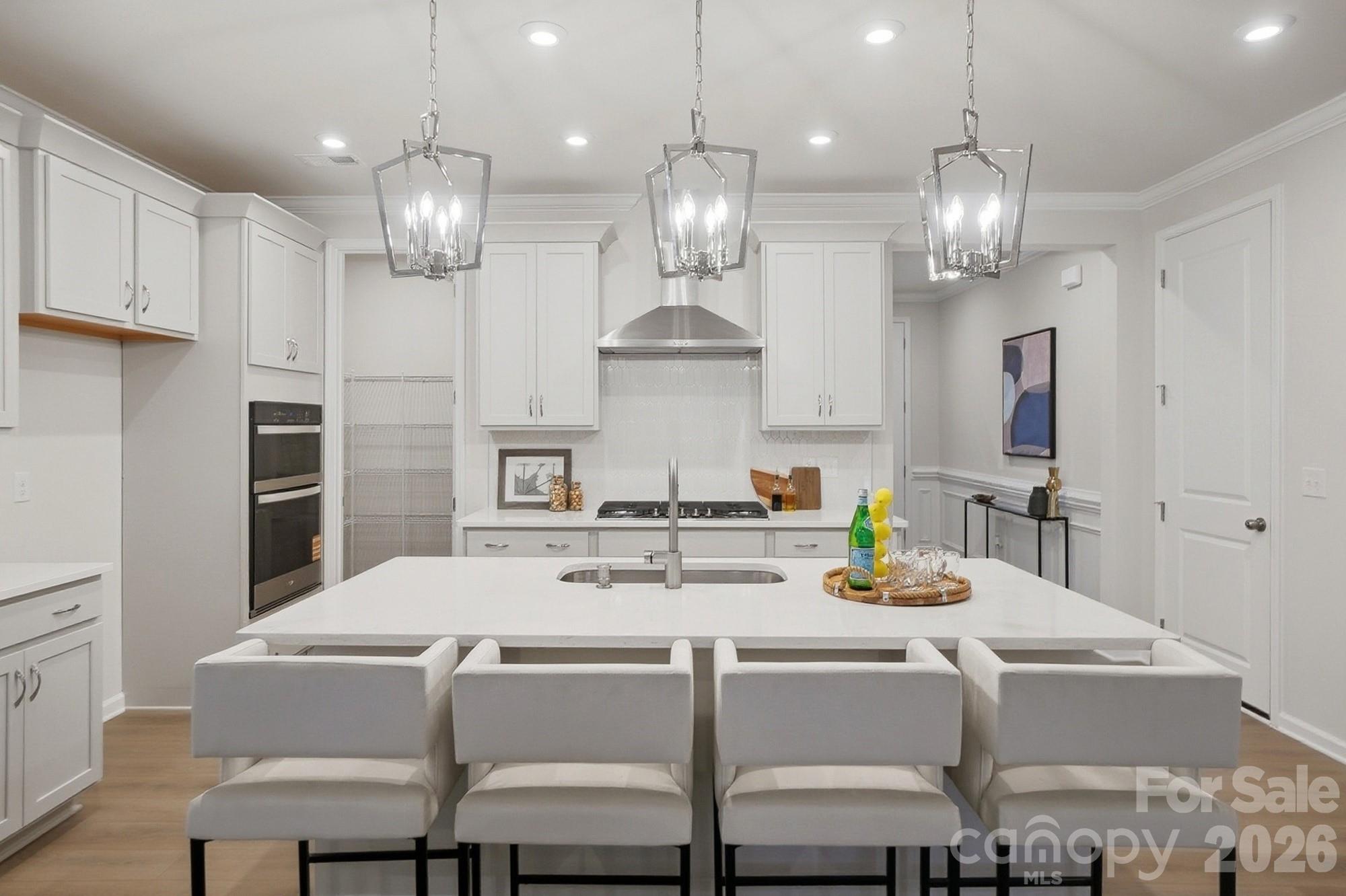 9931 Cask Way Huntersville, NC 28078 - Photo 9 of 42 a kitchen with a dining table and chairs