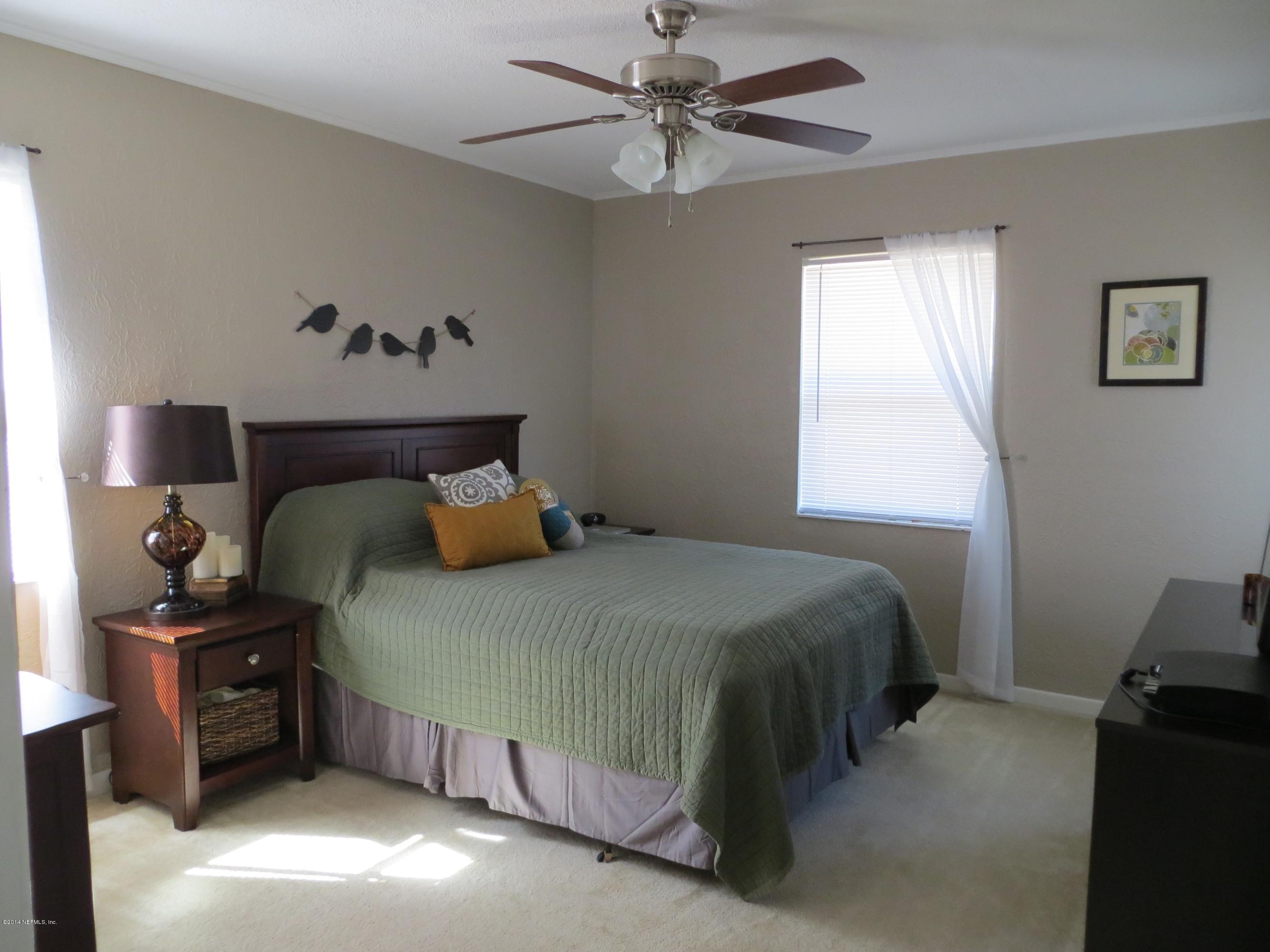 6025 Stetson Road Jacksonville, FL 32217 - Photo 5 of 13 a bedroom with a bed and a window