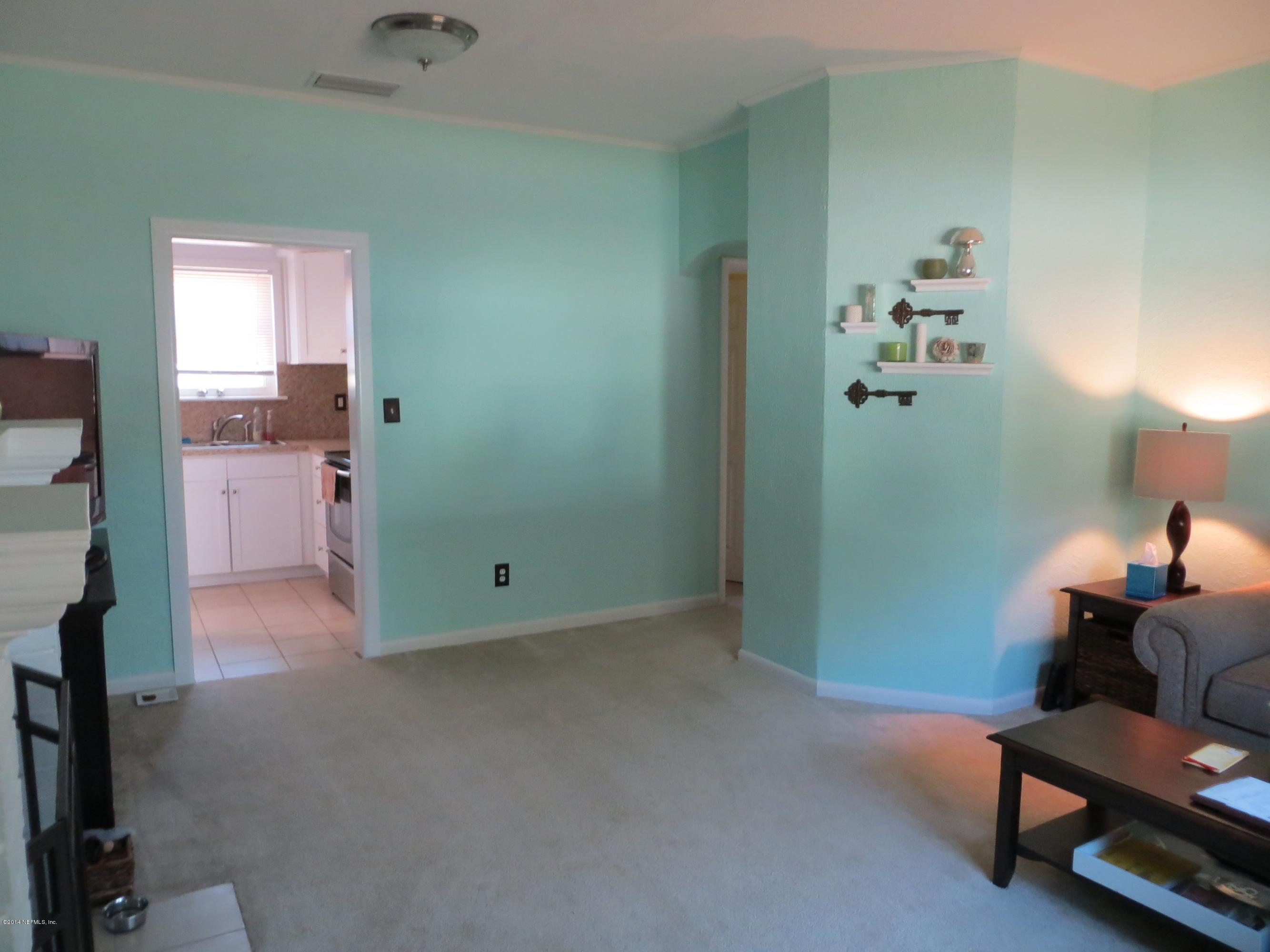 6025 Stetson Road Jacksonville, FL 32217 - Photo 8 of 13 a room with painting and a table
