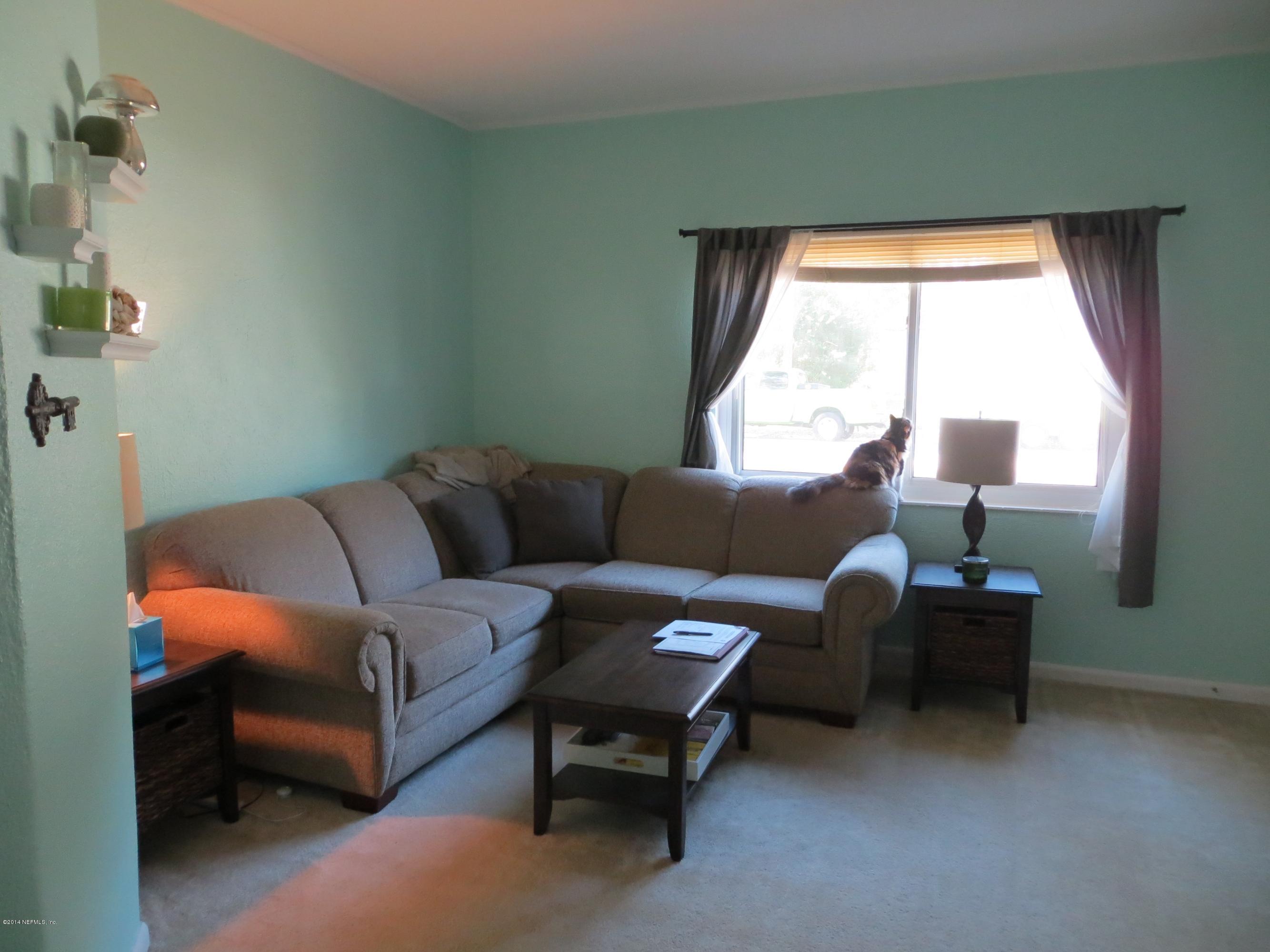 6025 Stetson Road Jacksonville, FL 32217 - Photo 9 of 13 a living room with furniture and a window