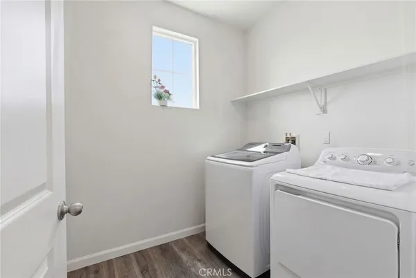 a bathroom with a sink a toilet and shower curtain
