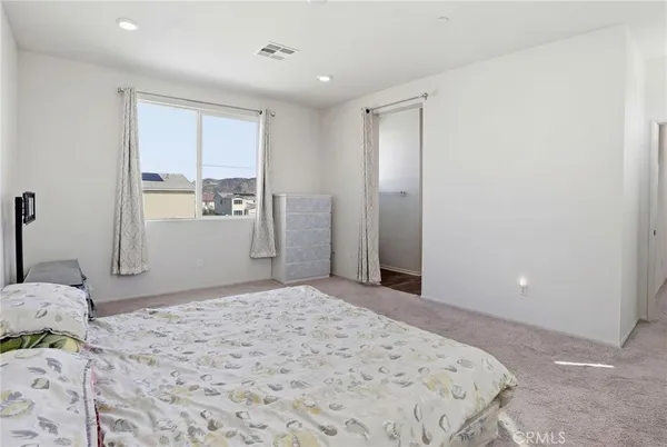 a bedroom with a bed and furniture