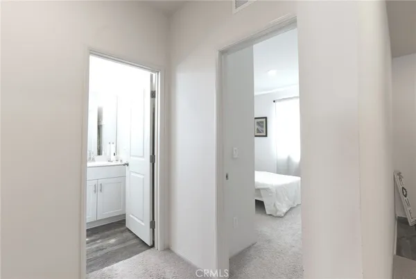a bedroom with a bed and a cabinets