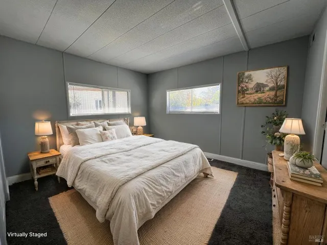 a bedroom with bed and window