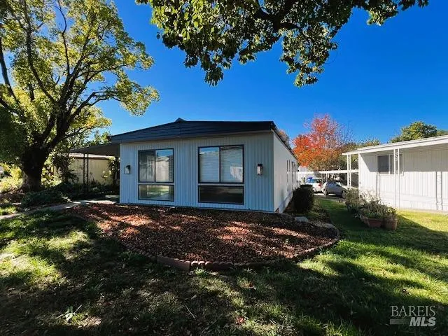 a view of a house with a yard