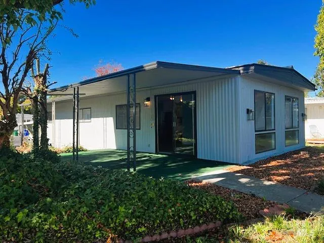 a view of a back yard of the house
