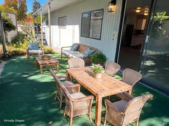a outdoor dining space with furniture and garden