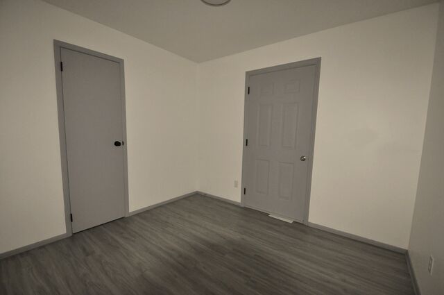 1703 Florence Street Streator, IL 61364 - Photo 13 of 33 a view of an empty room with wooden floor and closet
