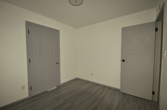 1703 Florence Street Streator, IL 61364 - Photo 14 of 33 a view of an empty room with wooden floor