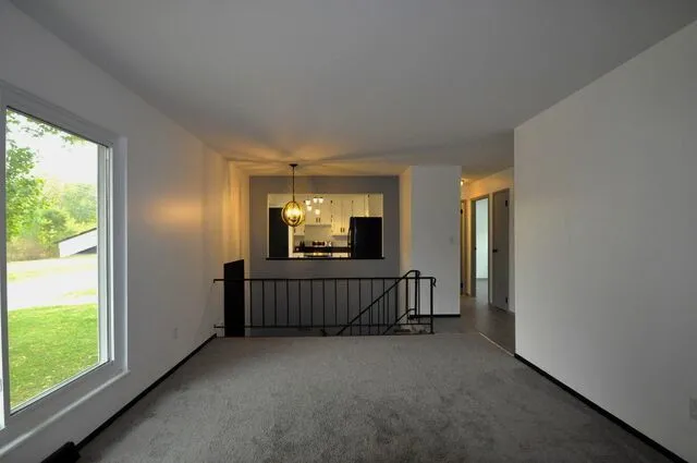 a view of living room with furniture and window