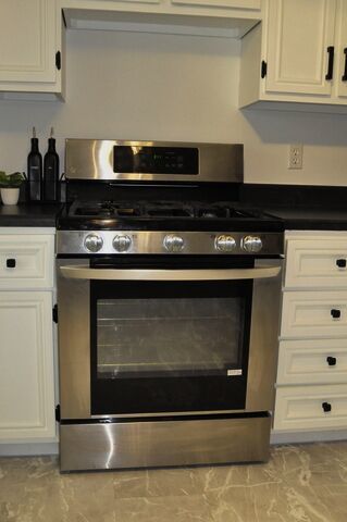 1703 Florence Street Streator, IL 61364 - Photo 8 of 33 a stove top oven sitting inside of a kitchen