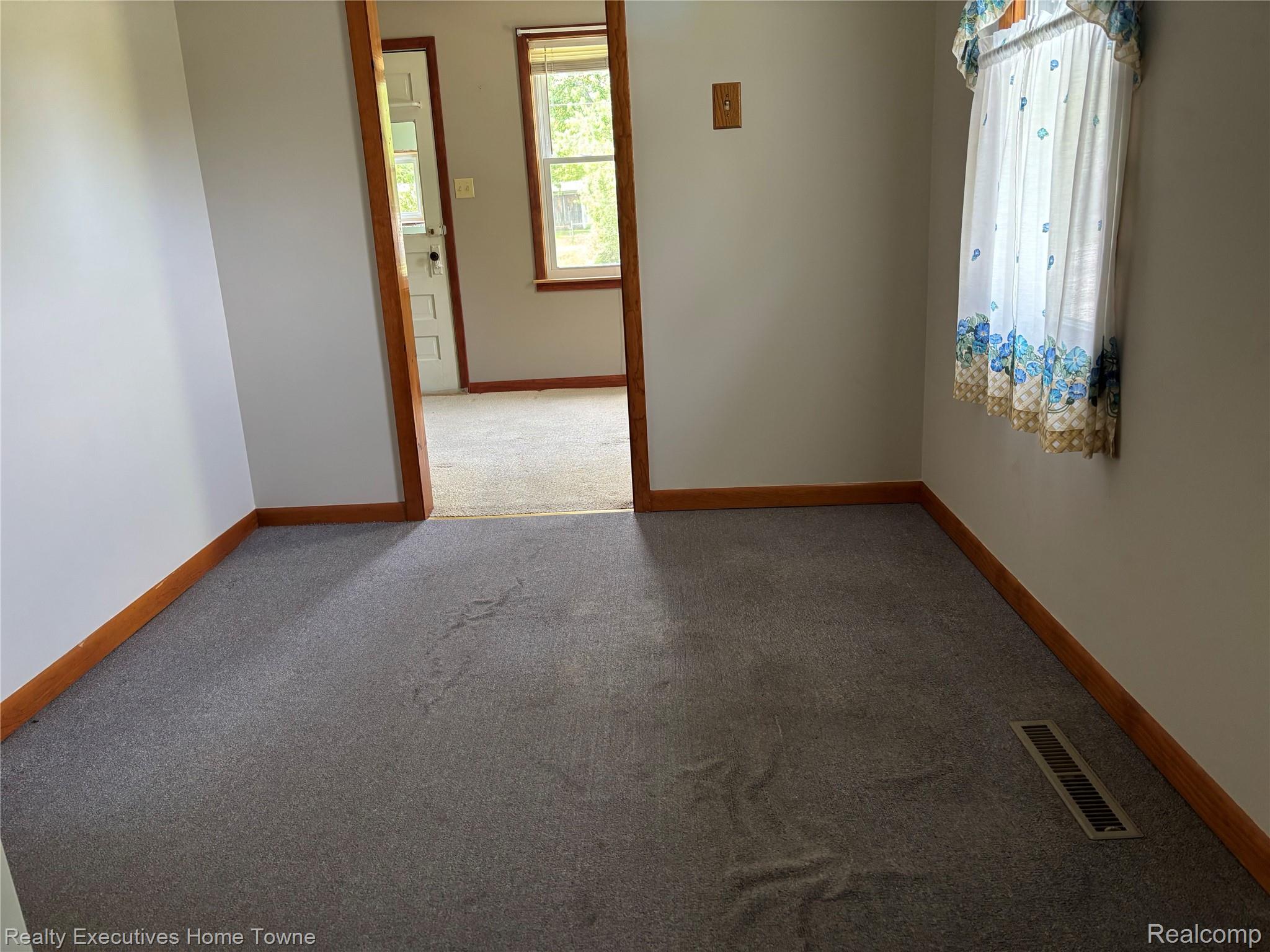 1782 Maple Road Smiths Creek, MI 48074 - Photo 22 of 30 Dining room featuring light colored carpet and baseboards