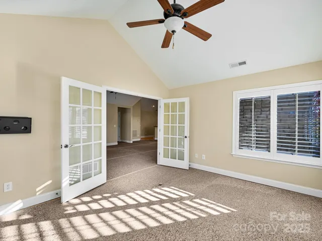 a view of empty room with windows