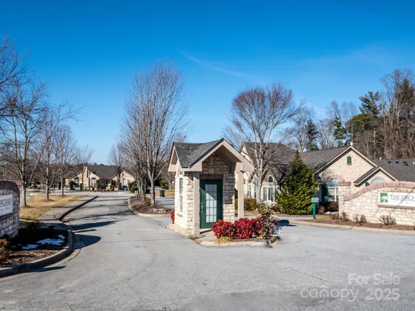 a view of a street with cars on the road