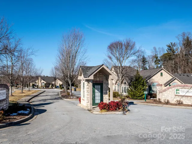 a view of a street with cars on the road