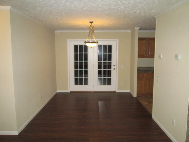 2542 Porters Mountain Road Blue Ridge, VA 24064 - Photo 15 of 31 a view of an empty room with wooden floor and a window