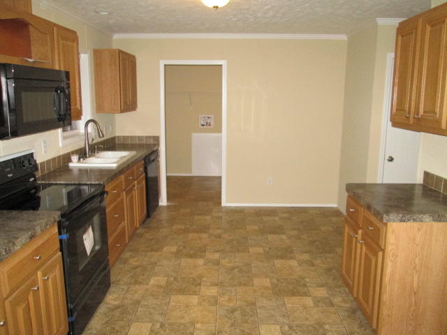 2542 Porters Mountain Road Blue Ridge, VA 24064 - Photo 16 of 31 a kitchen with stainless steel appliances granite countertop a sink stove and refrigerator