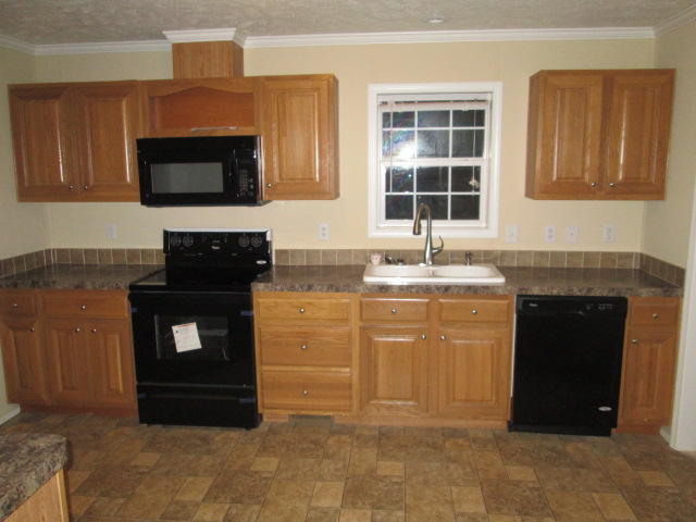 2542 Porters Mountain Road Blue Ridge, VA 24064 - Photo 17 of 31 a kitchen with a sink and a microwave