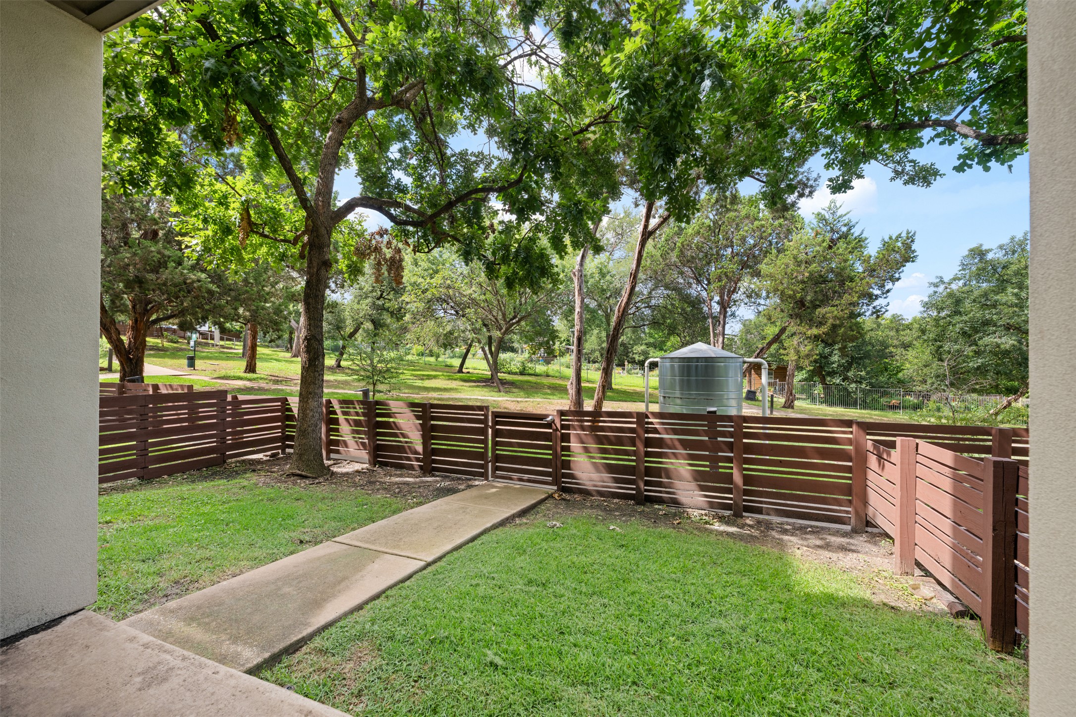 2804 Treble Lane, Unit 902 Austin, TX 78704 - Photo 1 of 31 a view of a bench in a garden