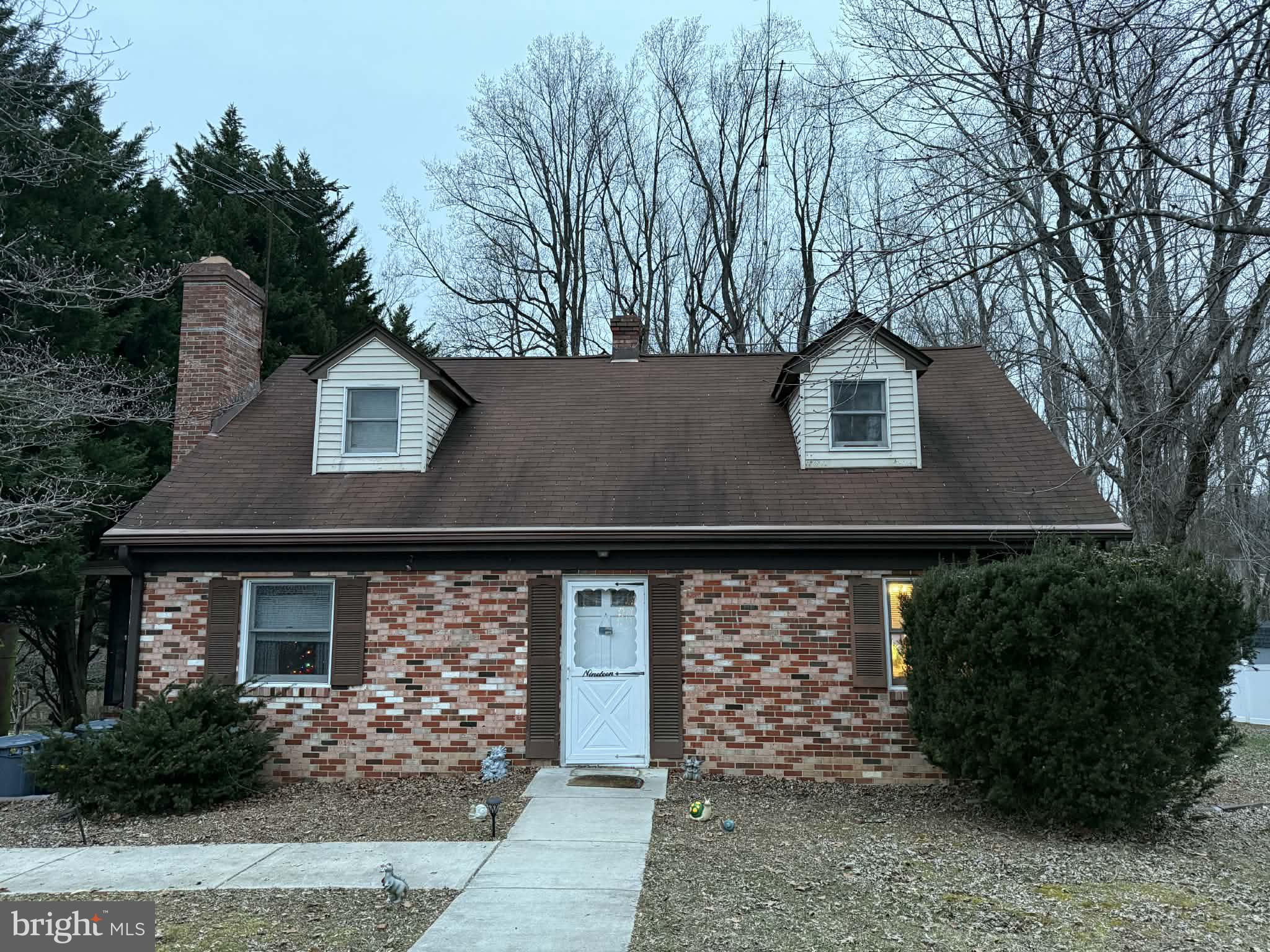 19 Well Street Huntingtown, MD 20639 - Photo 1 of 1 a front view of a house with garden