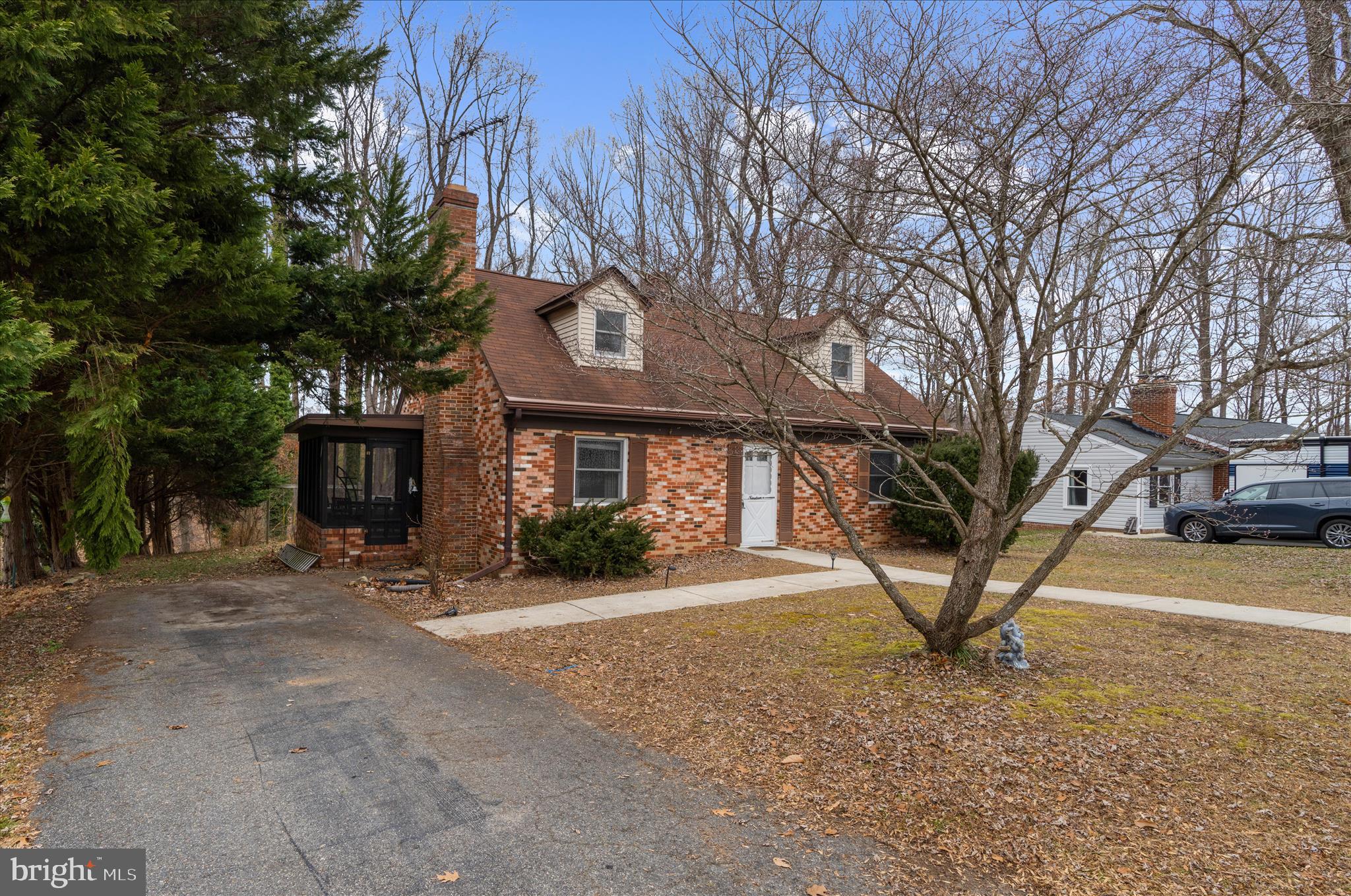 a view of a house with a yard and garage