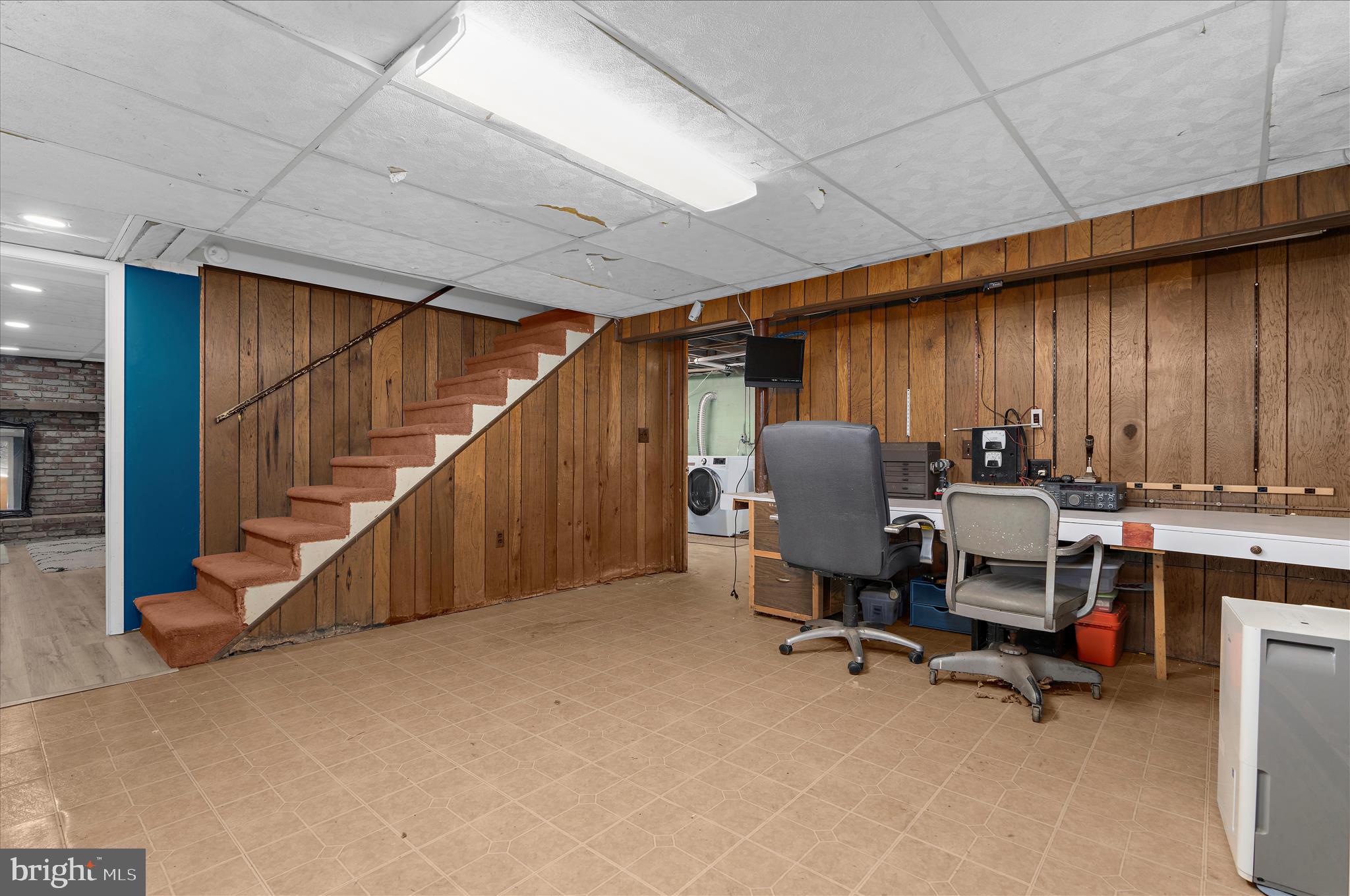 19 Well Street Huntingtown, MD 20639 - Photo 28 of 44 a workspace with furniture and stairs