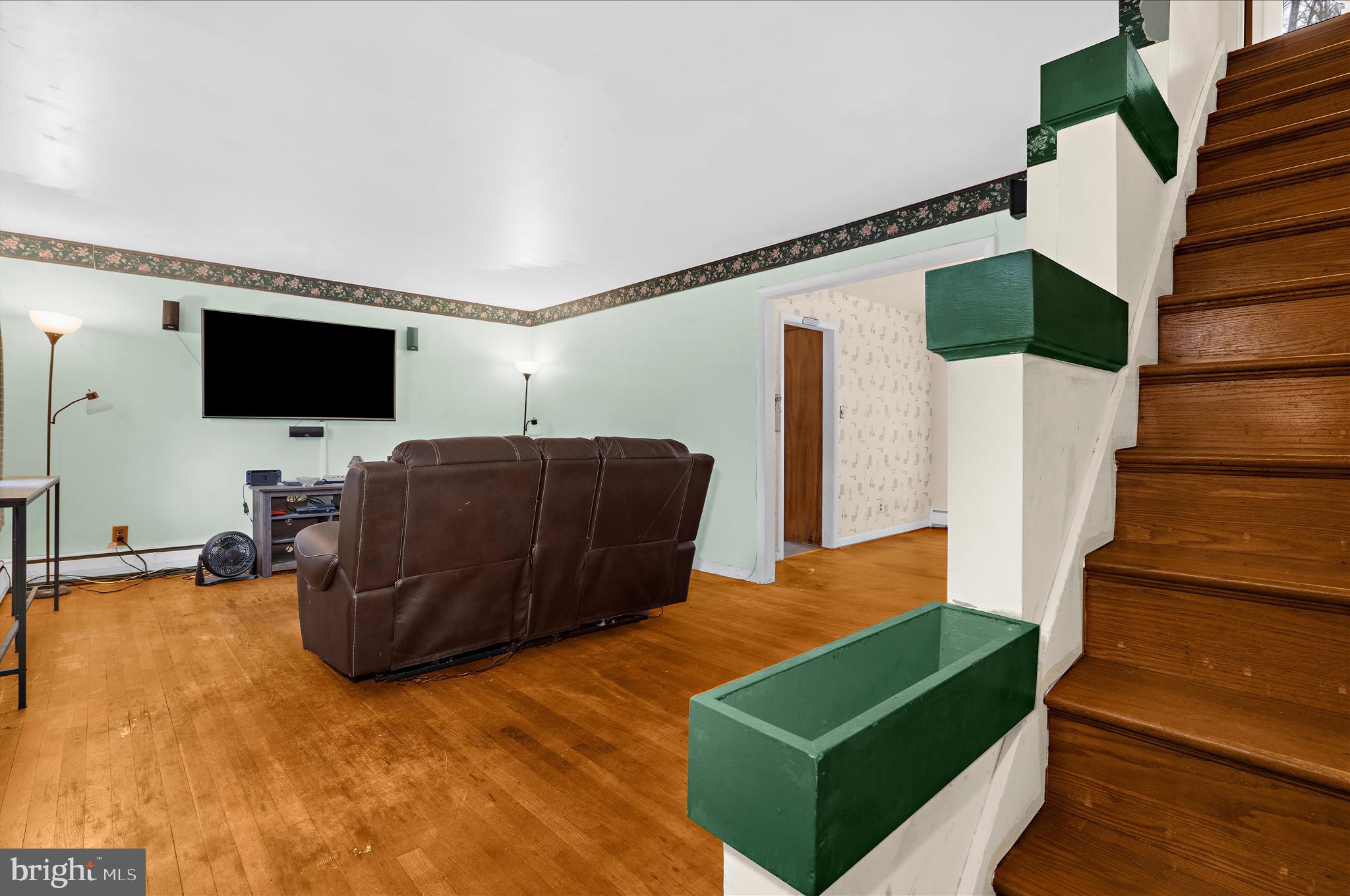 19 Well Street Huntingtown, MD 20639 - Photo 3 of 44 a living room with furniture and a flat screen tv