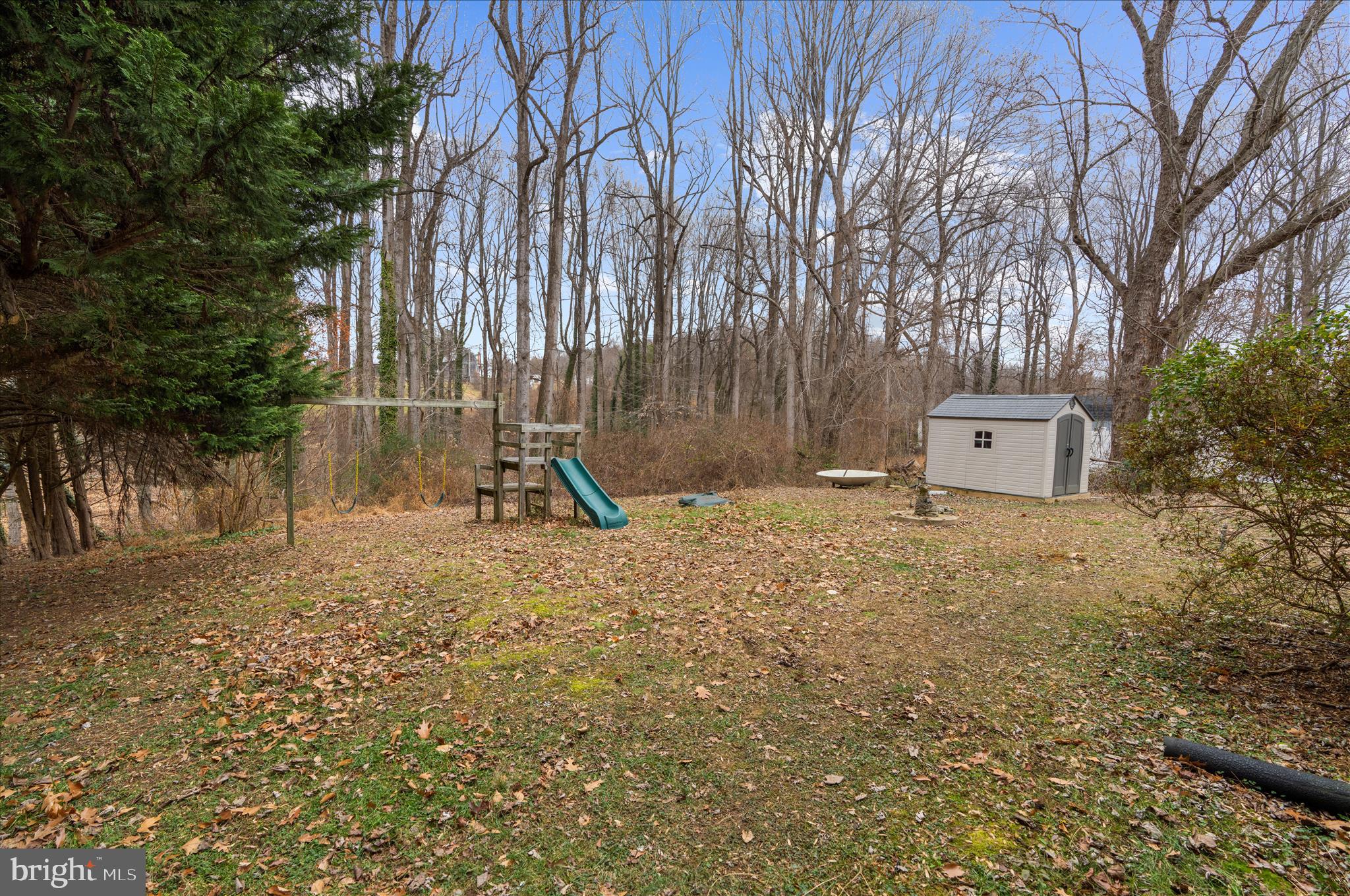 19 Well Street Huntingtown, MD 20639 - Photo 36 of 44 a backyard of a house with a trees