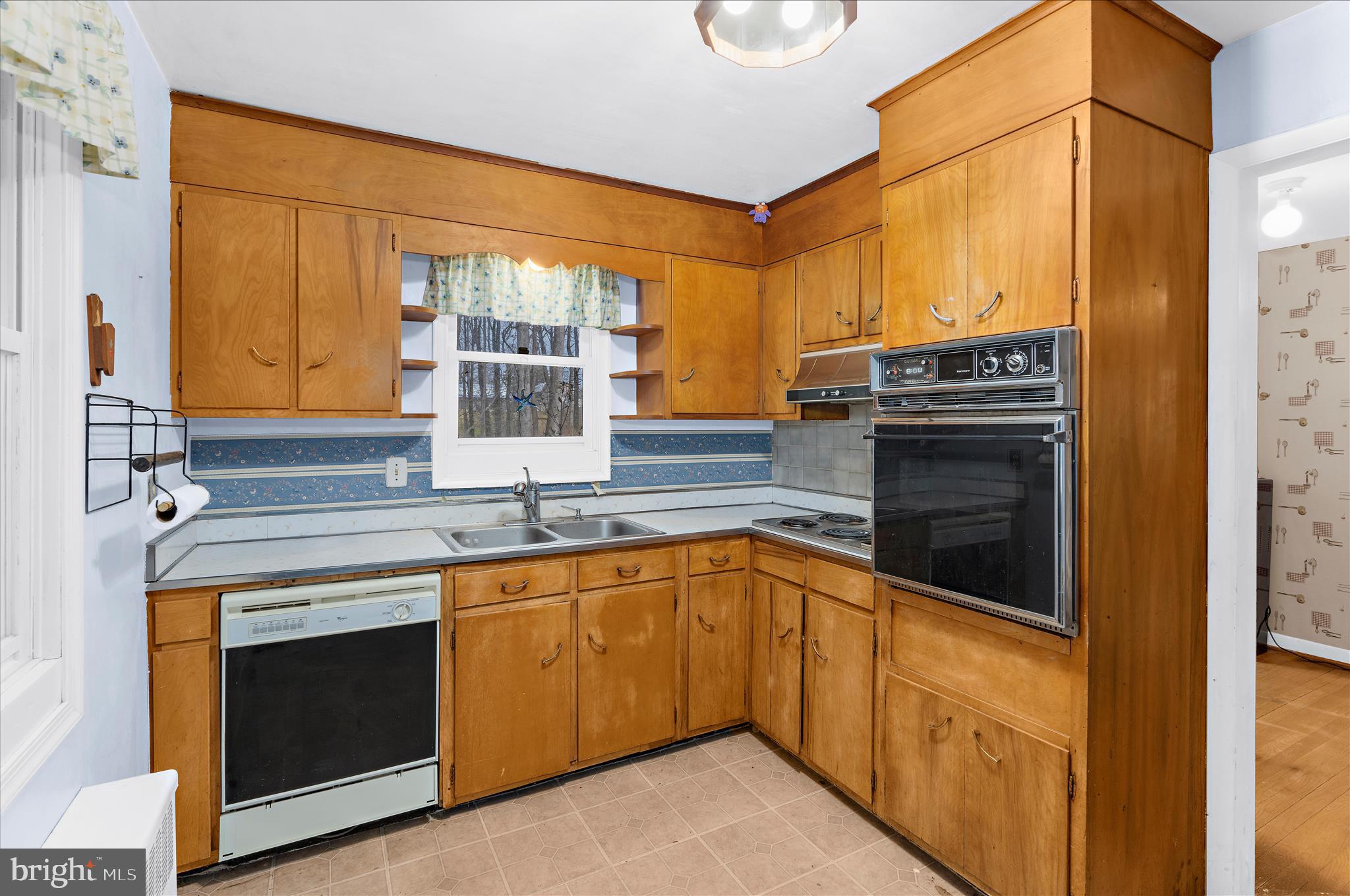 19 Well Street Huntingtown, MD 20639 - Photo 10 of 44 a kitchen with stainless steel appliances granite countertop a stove and a sink