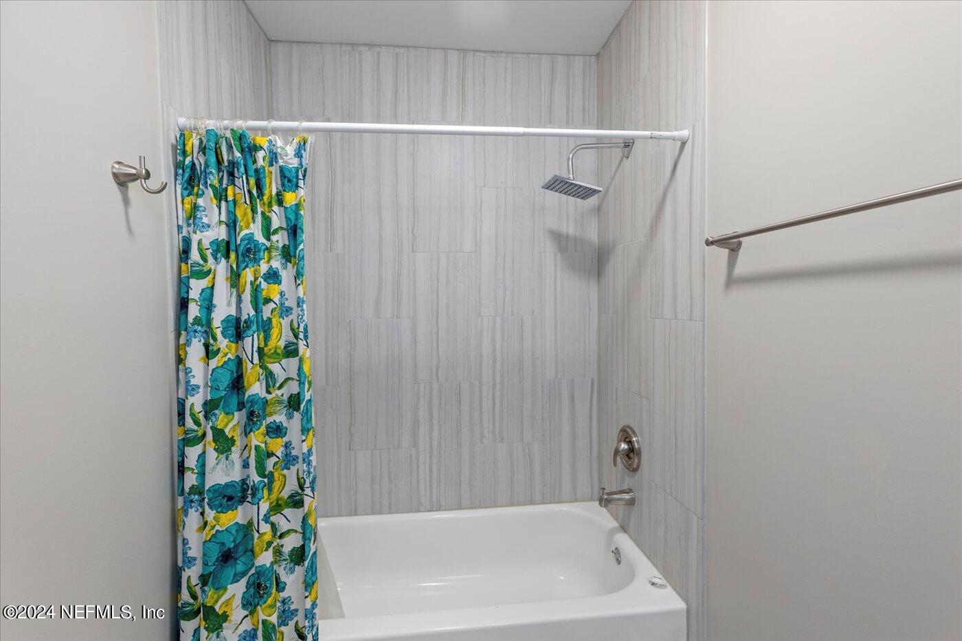 1273 Lechlade Circle Jacksonville, FL 32205 - Photo 21 of 33 a bathroom with a shower and a bathtub