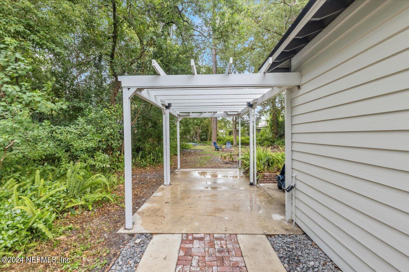 1273 Lechlade Circle Jacksonville, FL 32205 - Photo 26 of 33 a view of a porch with a backyard