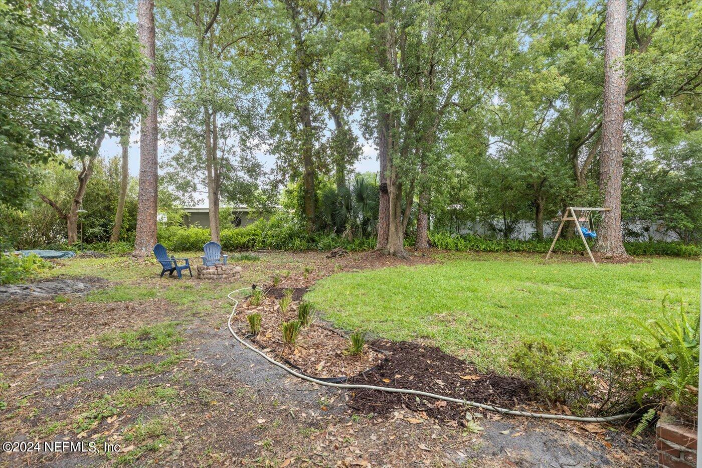 1273 Lechlade Circle Jacksonville, FL 32205 - Photo 27 of 33 a view of a backyard with large trees