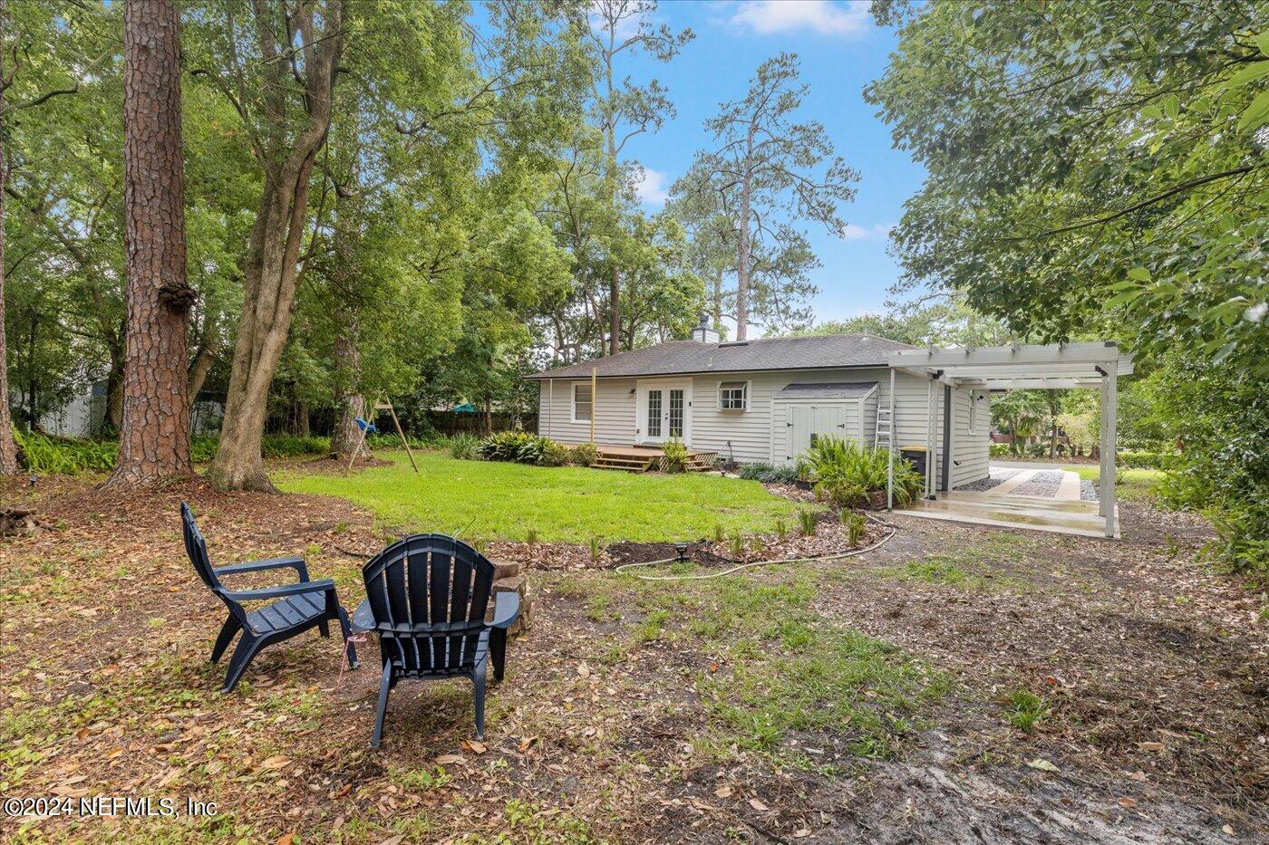 1273 Lechlade Circle Jacksonville, FL 32205 - Photo 28 of 33 a view of a house with backyard and sitting area