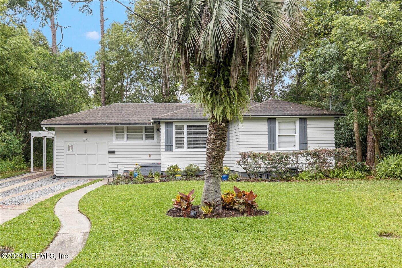 1273 Lechlade Circle Jacksonville, FL 32205 - Photo 3 of 33 a front view of a house with a yard