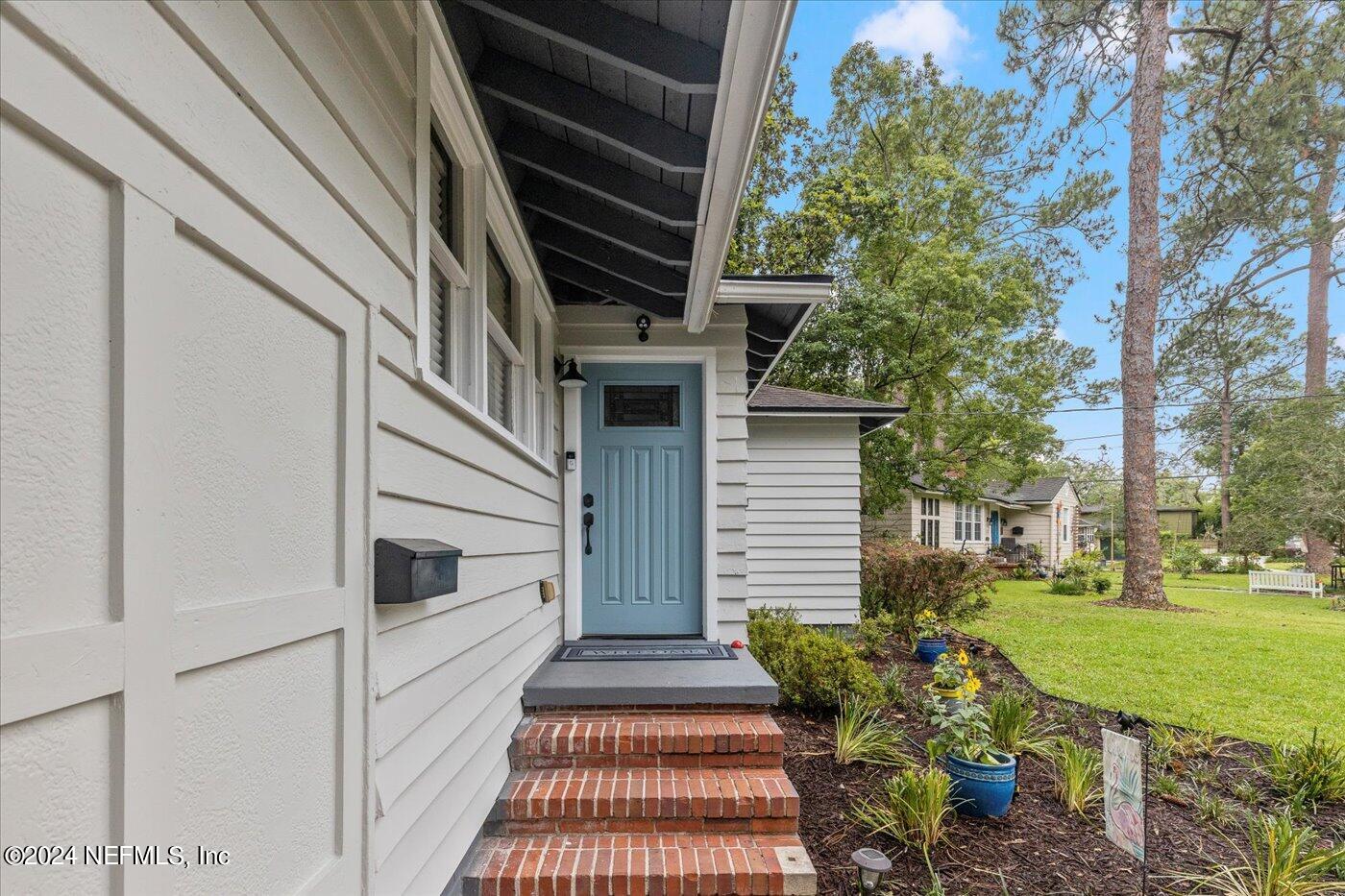 1273 Lechlade Circle Jacksonville, FL 32205 - Photo 6 of 33 a view of a patio with table and chairs and potted plants