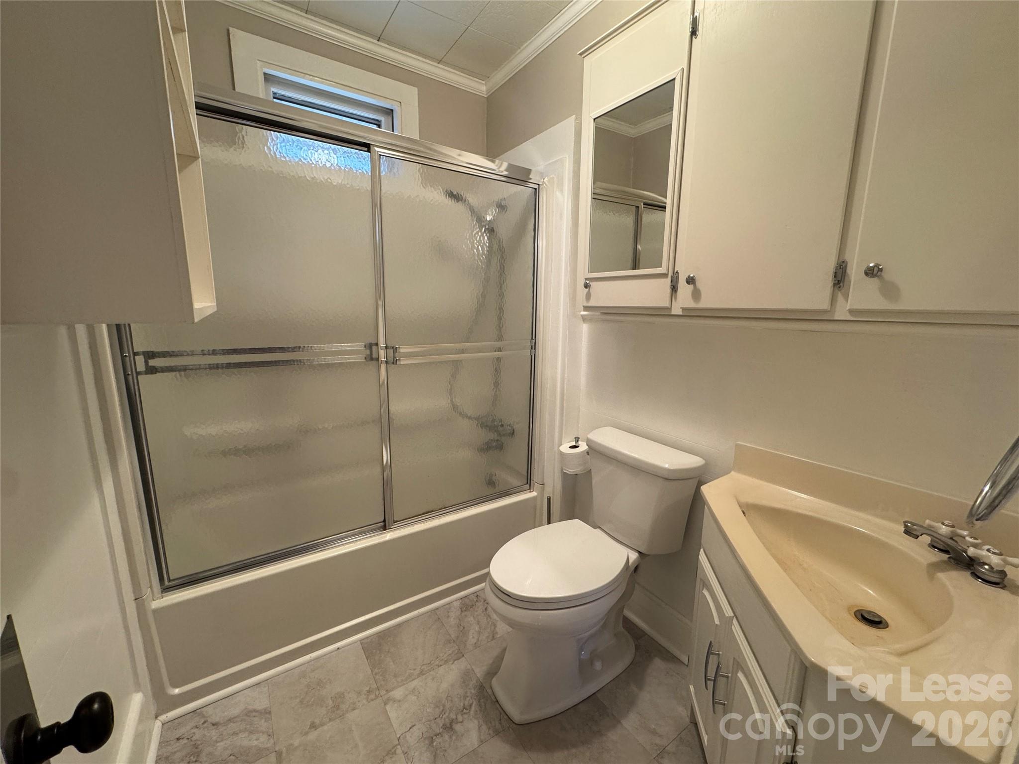 9019 Reames Road Charlotte, NC 28216 - Photo 7 of 7 a bathroom with a toilet and a shower