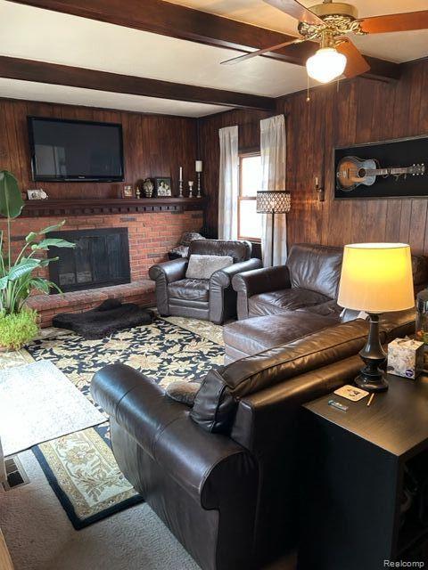 29312 Raleigh Road Farmington, MI 48336 - Photo 10 of 24 Wood paneled den with fireplace