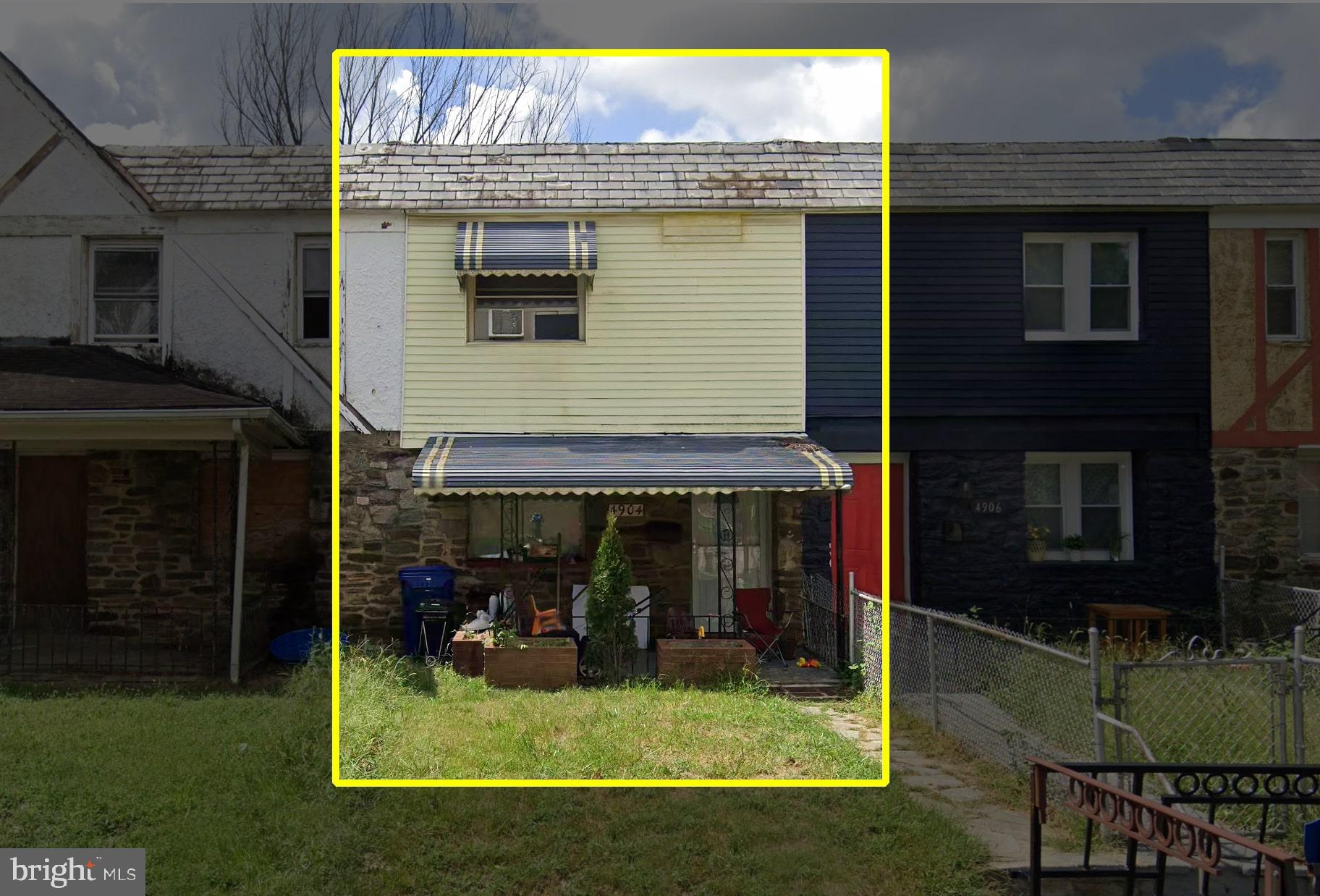 a view of a house with backyard porch and sitting area