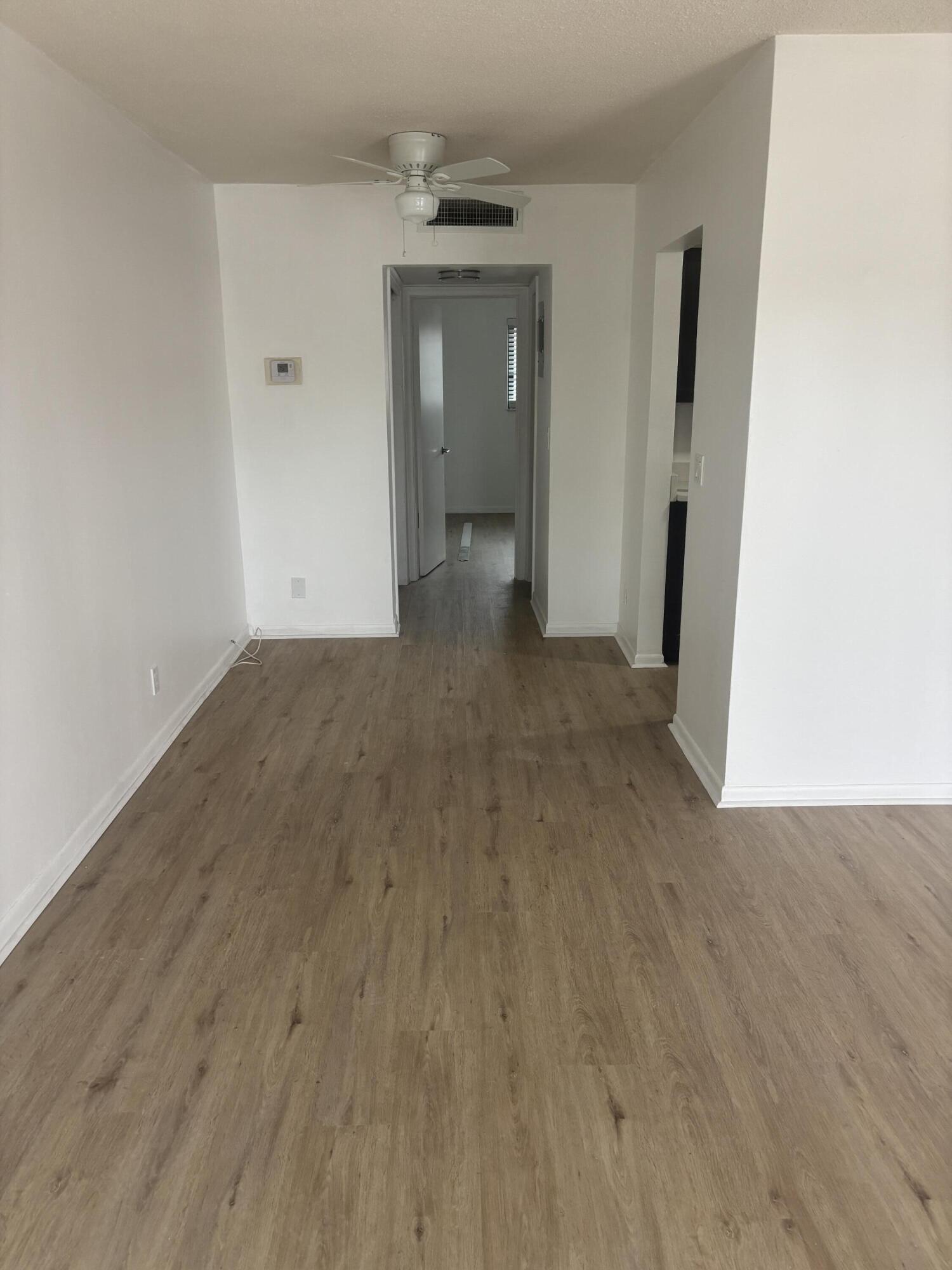 521 Northeast 45th Street Boca Raton, FL 33431 - Photo 6 of 17 a view of a room with wooden floor