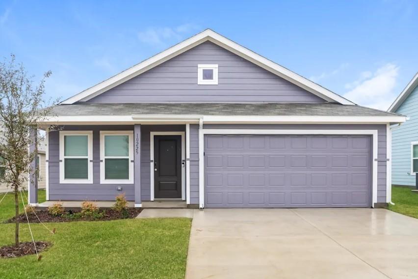 Single story home featuring driveway, a front lawn, and a shingled roof