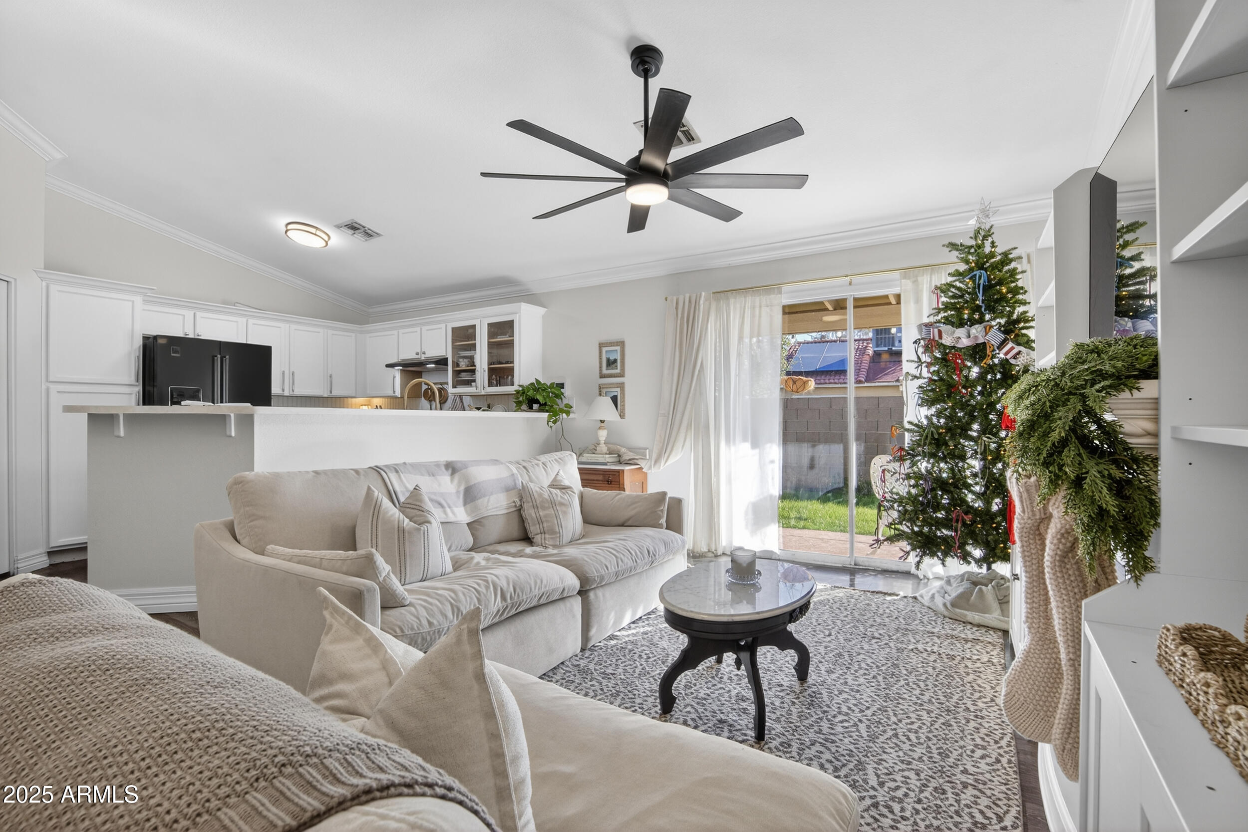 8429 West Coronado Road Phoenix, AZ 85037 - Photo 15 of 37 a living room with furniture and a potted plant