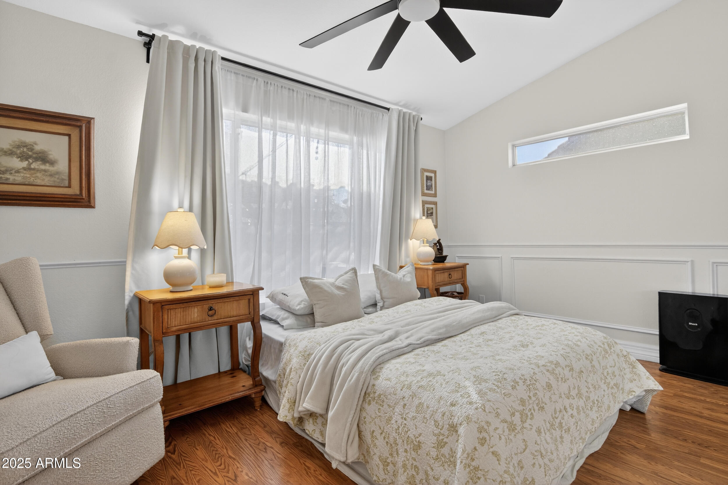 8429 West Coronado Road Phoenix, AZ 85037 - Photo 18 of 37 a bedroom with a bed and wooden floor
